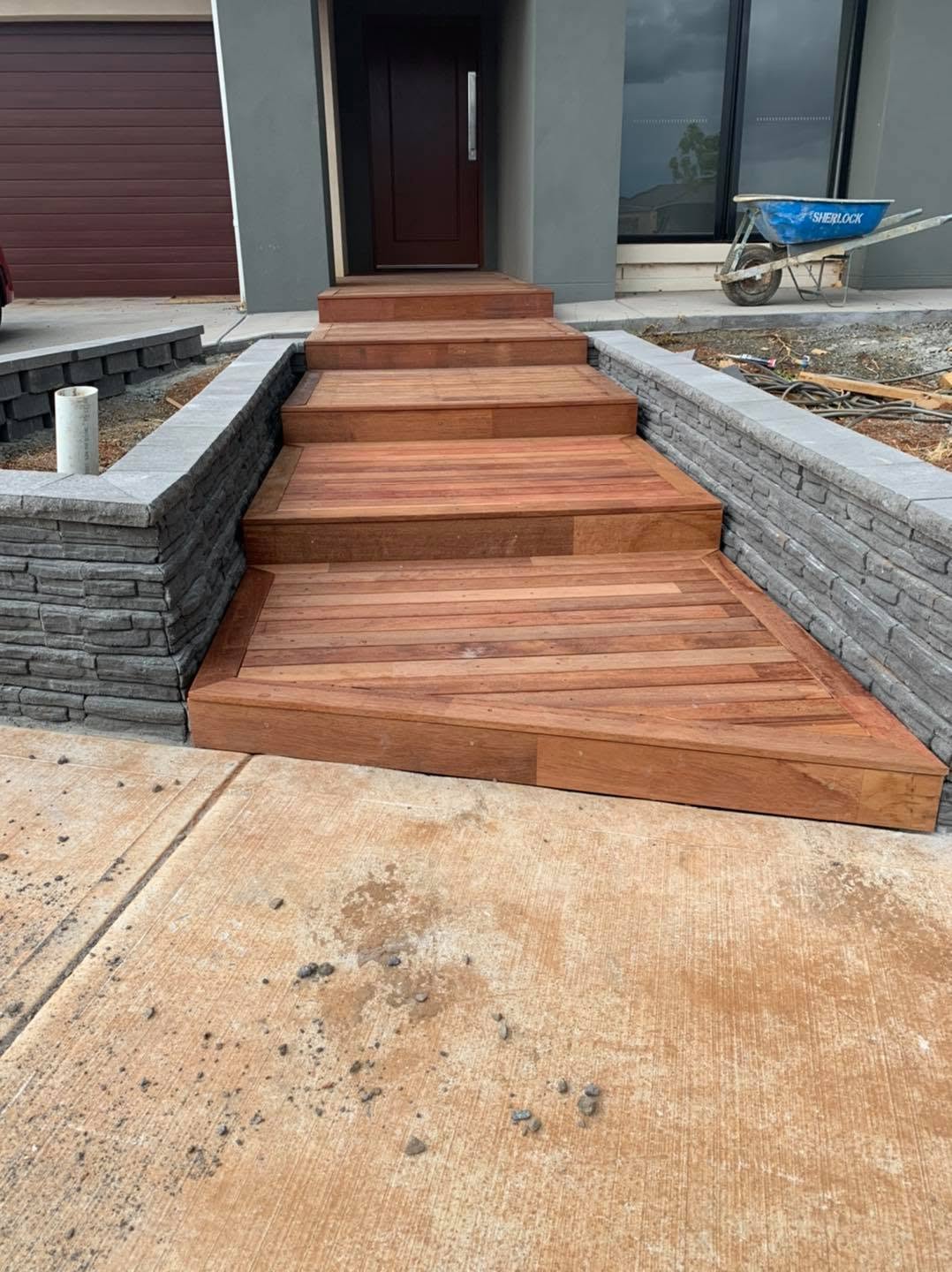 Merbau entry steps with stone retaining walls